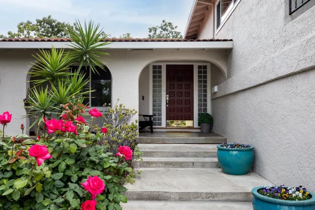 a front view of a house with outdoor space