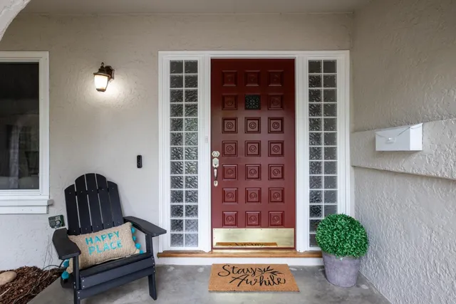 a view of a door and chair in the front of a door