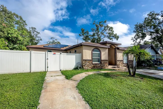 a front view of a house with garden