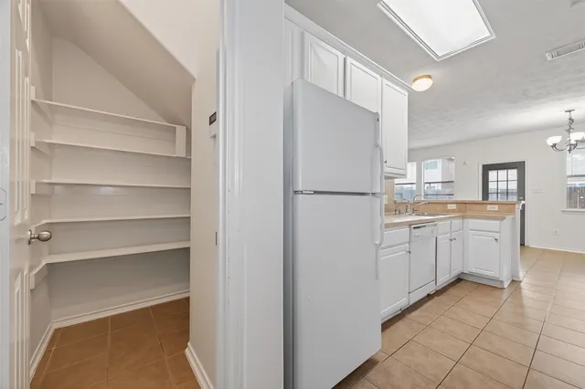 a kitchen with a refrigerator a sink and dishwasher