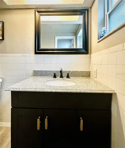 a bathroom with a sink and a mirror