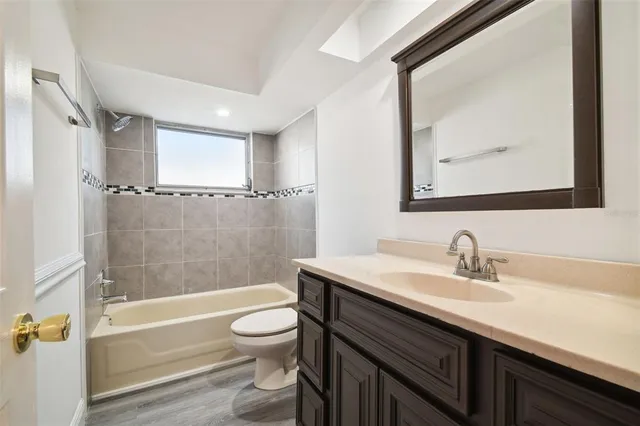 a bathroom with a sink a toilet and a bathtub
