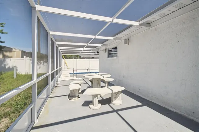 a view of a hallway with dining area