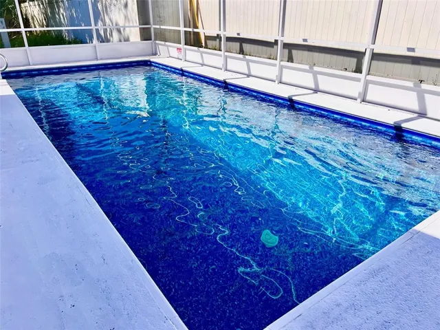 a view of swimming pool with a chair