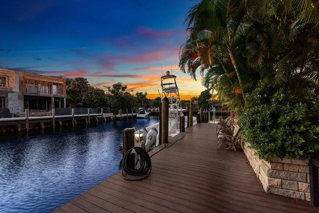 a view of a lake with outdoor seating