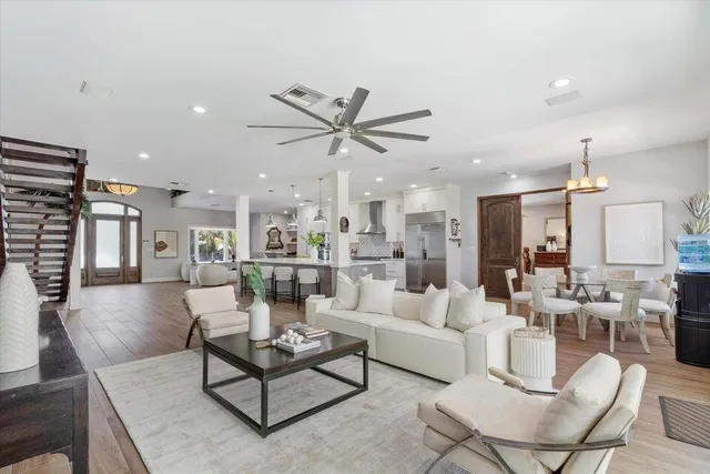 a spacious bedroom with a large bed and a large window