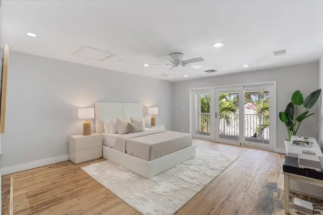 a bedroom with a large bed and a window