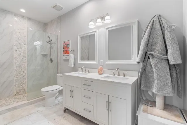 a bedroom with furniture and a wooden floor