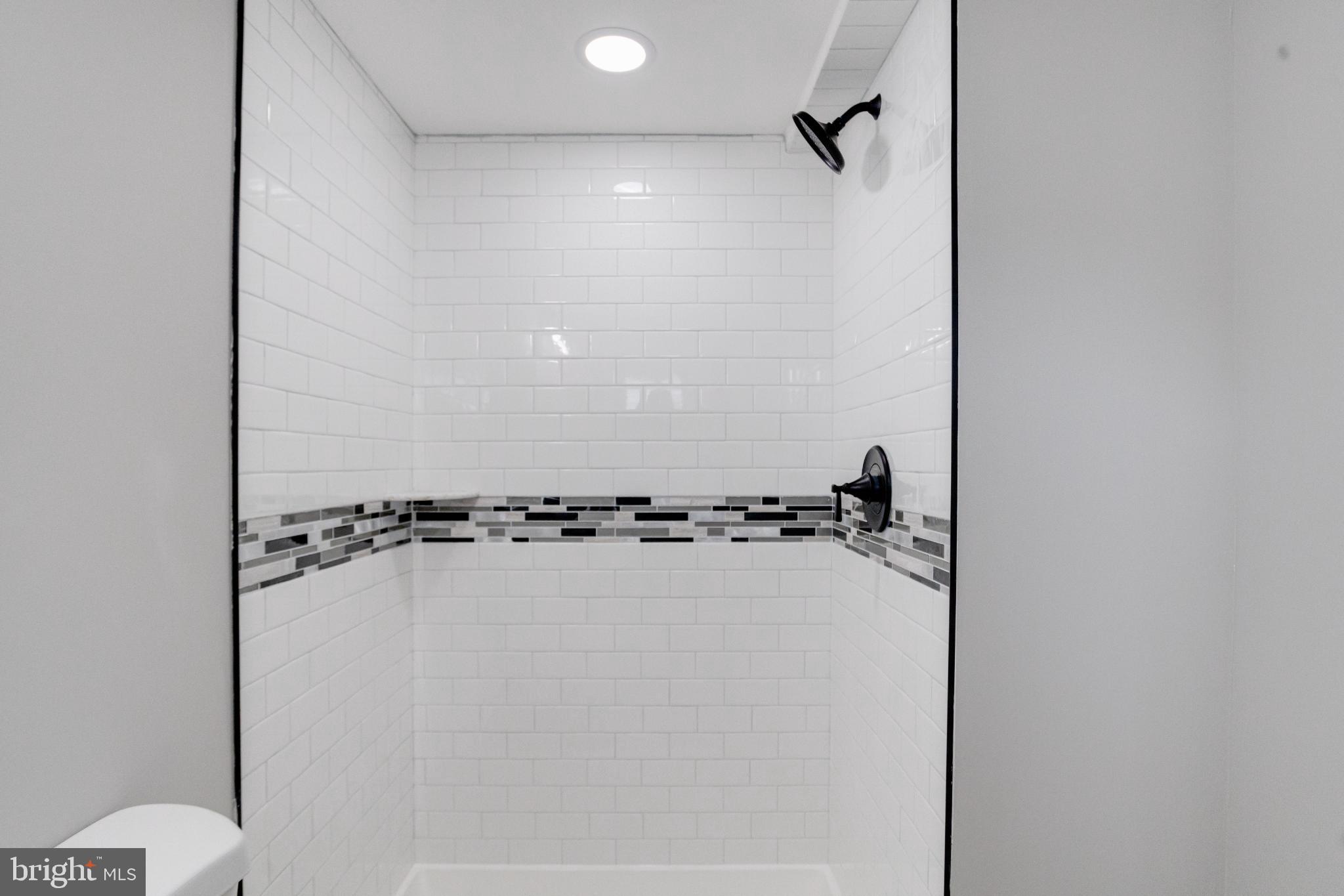 4604 Old Court Road Pikesville, MD 21208 - Photo 54 of 58 Sleek modern shower with stylish accents.