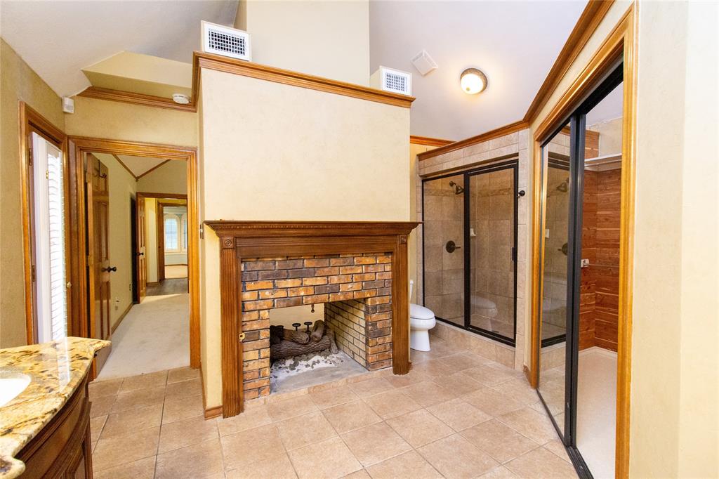 3014 Pecan Ridge Drive Rowlett, TX 75088 - Photo 13 of 29 a view of a hallway with a fireplace and a couch