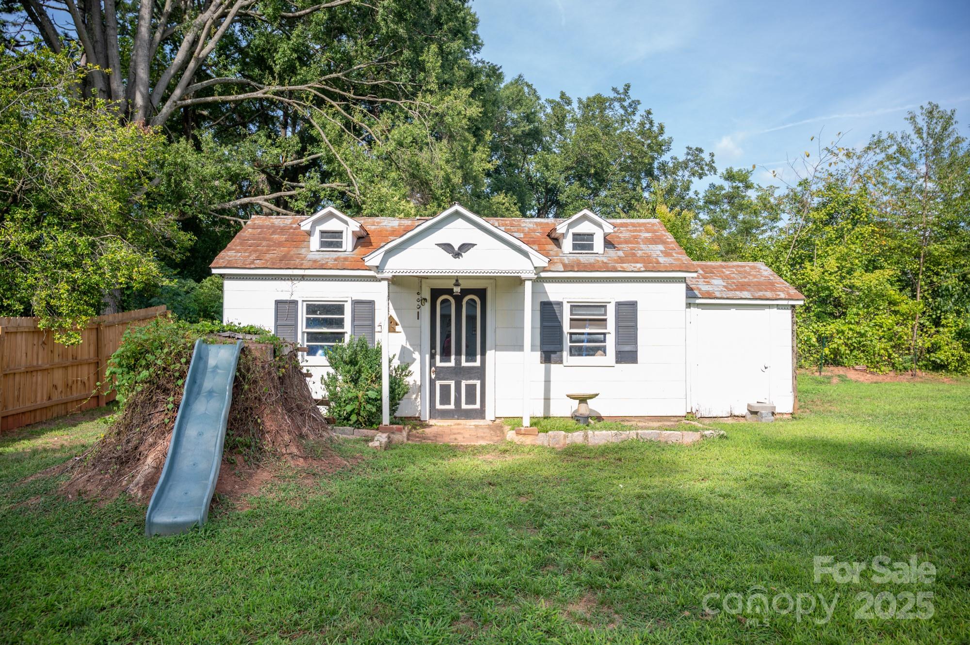 109 Old Rockwell Road China Grove, NC 28023 - Photo 22 of 22 a front view of a house with a yard and trees