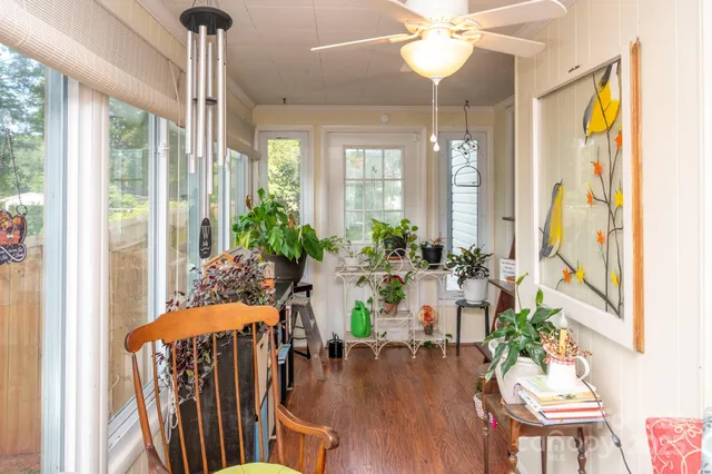 a view of a dining room with furniture window and wooden floor