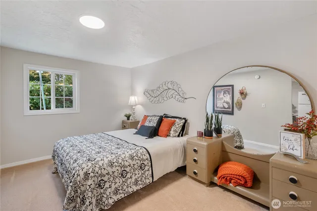 a bedroom with bed and a window