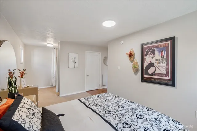 a bedroom with a bed and hallway