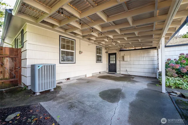 a view of backyard with a barn and garage