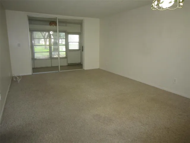 an empty room with windows and view