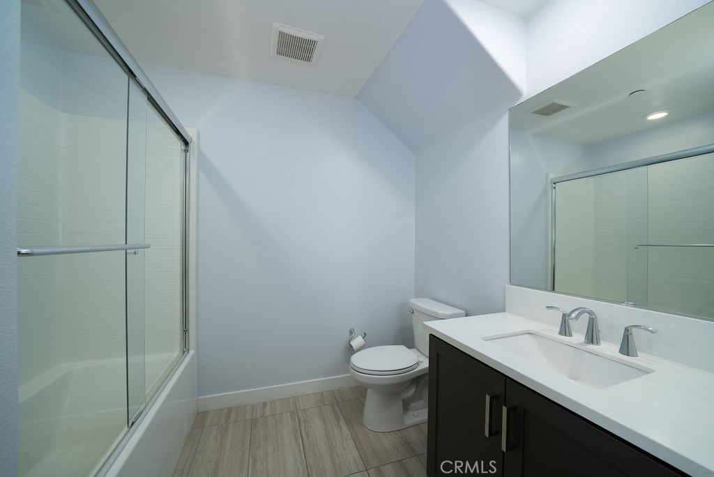 430 Transport Tustin, CA 92782 - Photo 13 of 37 a bathroom with a sink a toilet and shower
