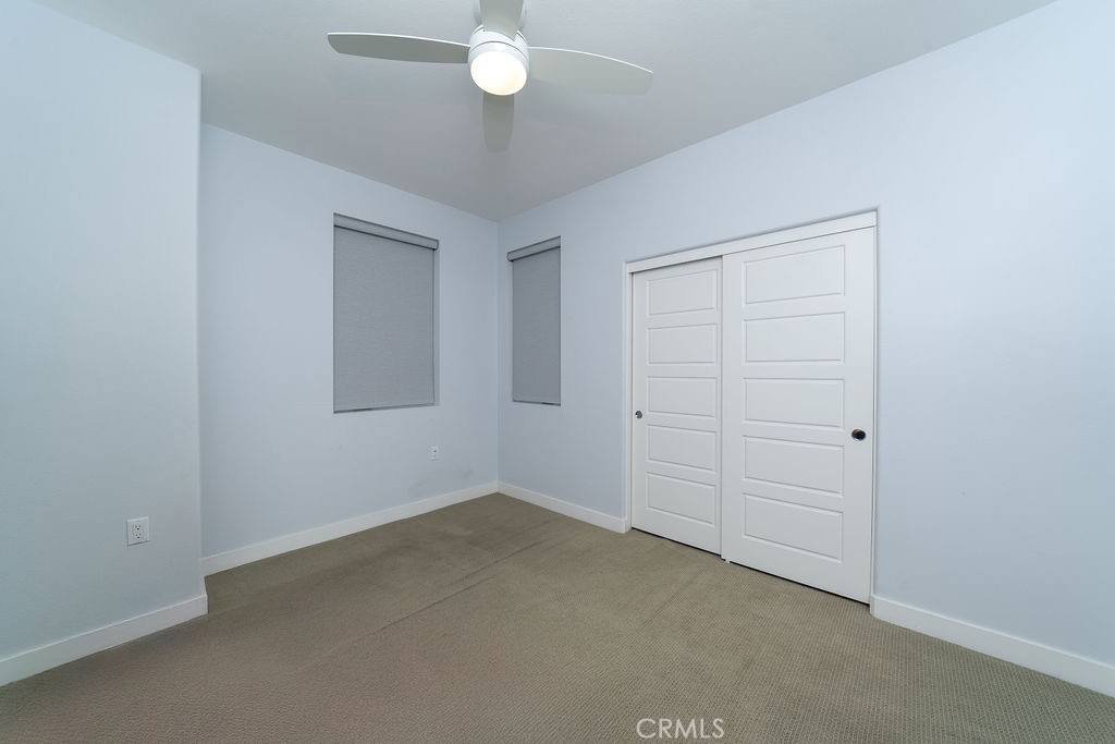 430 Transport Tustin, CA 92782 - Photo 15 of 37 an empty room with a chandelier fan