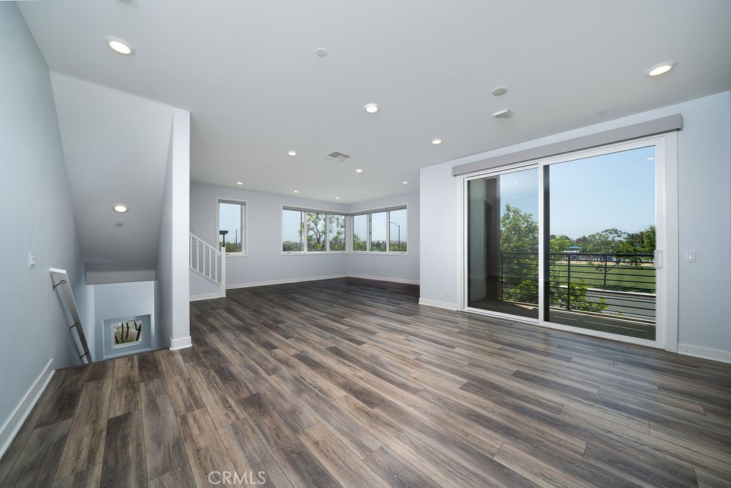 430 Transport Tustin, CA 92782 - Photo 21 of 37 a view of empty room with wooden floor and fan