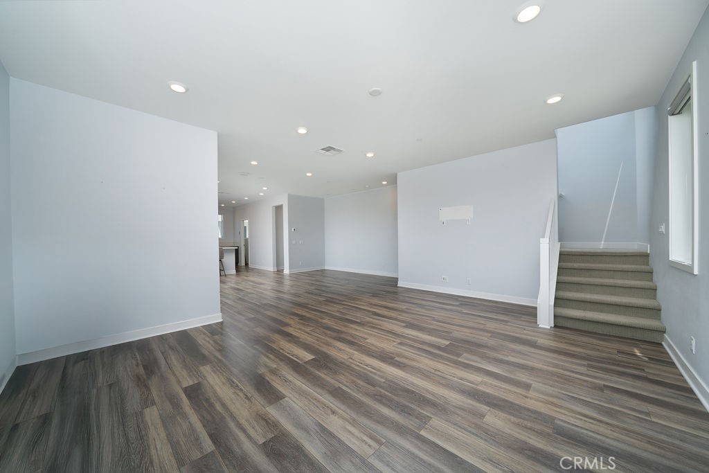 430 Transport Tustin, CA 92782 - Photo 27 of 37 a view of an empty room with wooden floor