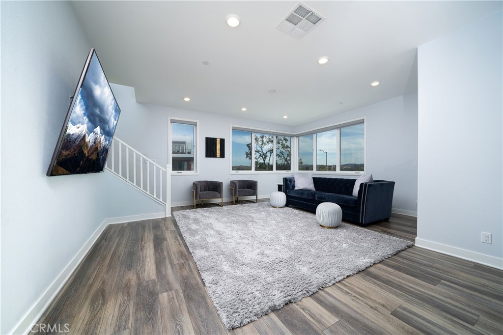 430 Transport Tustin, CA 92782 - Photo 3 of 37 a living room with furniture and a flat screen tv
