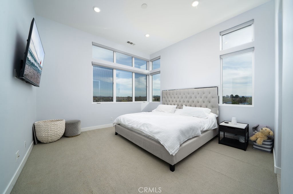 430 Transport Tustin, CA 92782 - Photo 35 of 37 a bedroom with a bed and a large window