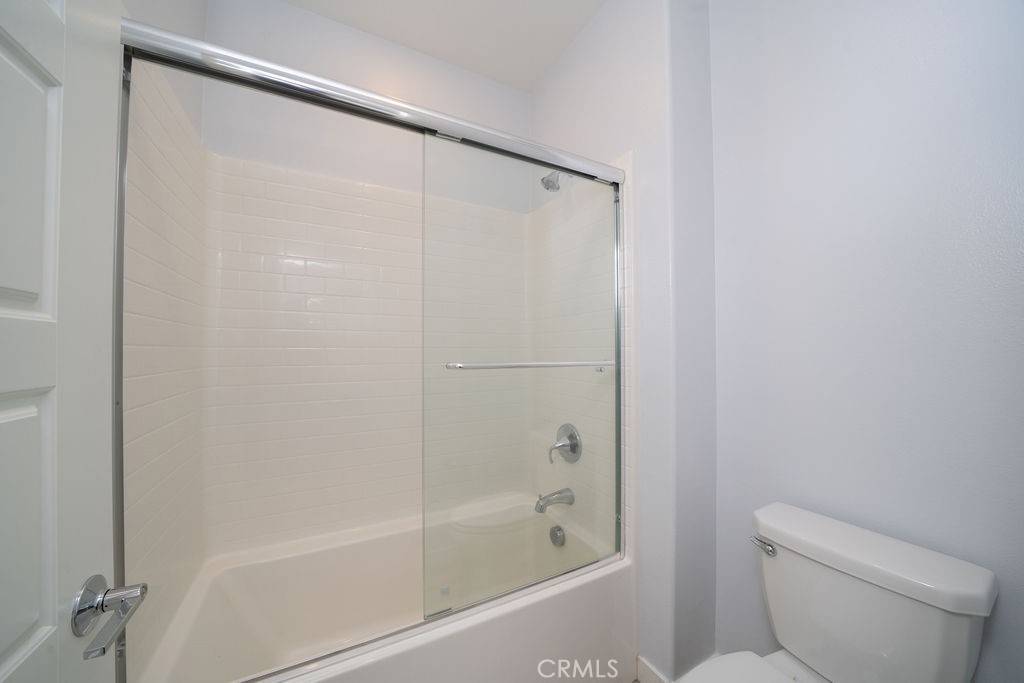 430 Transport Tustin, CA 92782 - Photo 9 of 37 a bathroom with a bathtub and a toilet