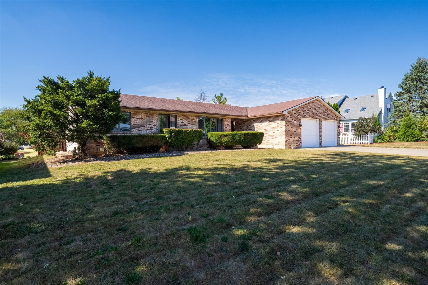 315 Garden Road Normal, IL 61761 - Photo 24 of 32 a front view of a house with a yard and garage