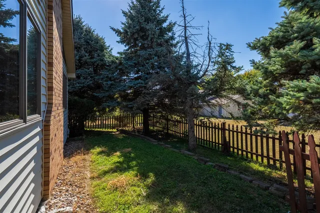 a view of a backyard with pathway