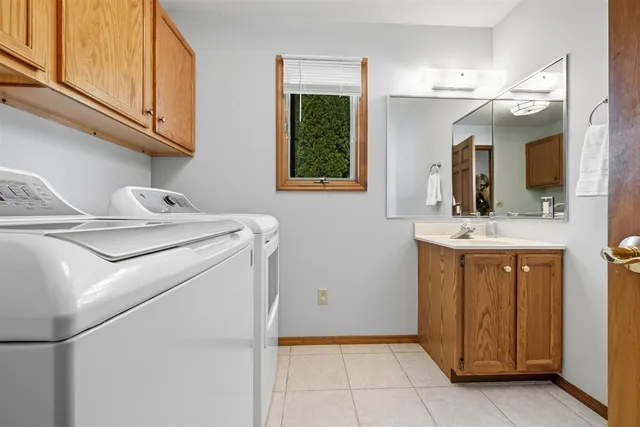 a bathroom with a sink a vanity and a mirror