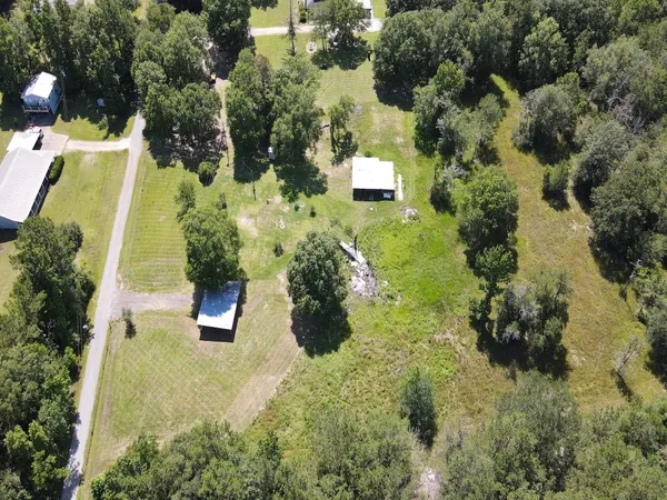 an aerial view of residential house with outdoor space