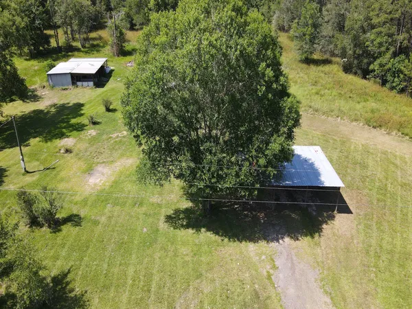 a aerial view of residential houses with yard