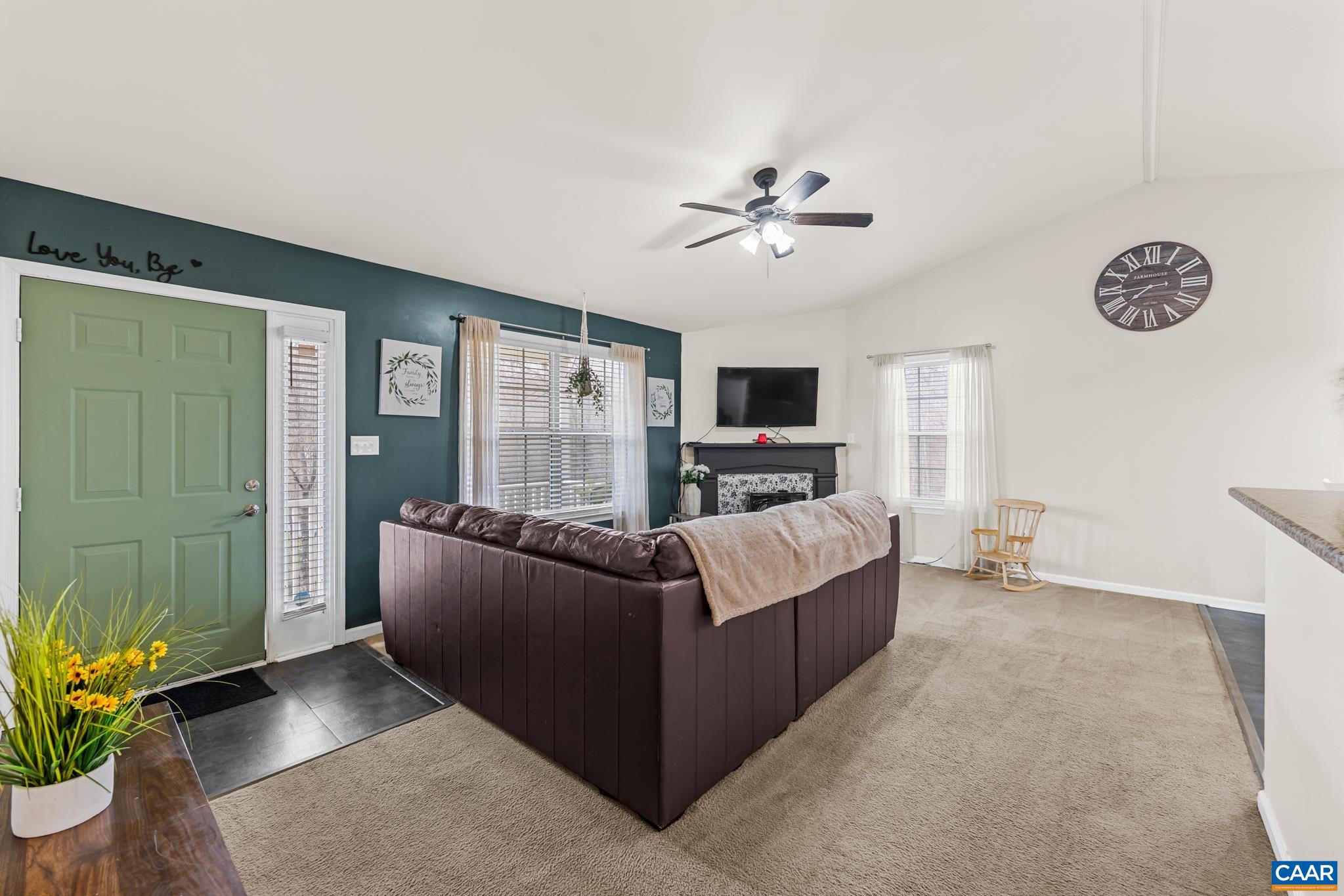 1029 West Daffodil Road Ruckersville, VA 22968 - Photo 15 of 39 a living room with furniture and a flat screen tv