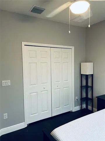 a view of a bedroom with closet