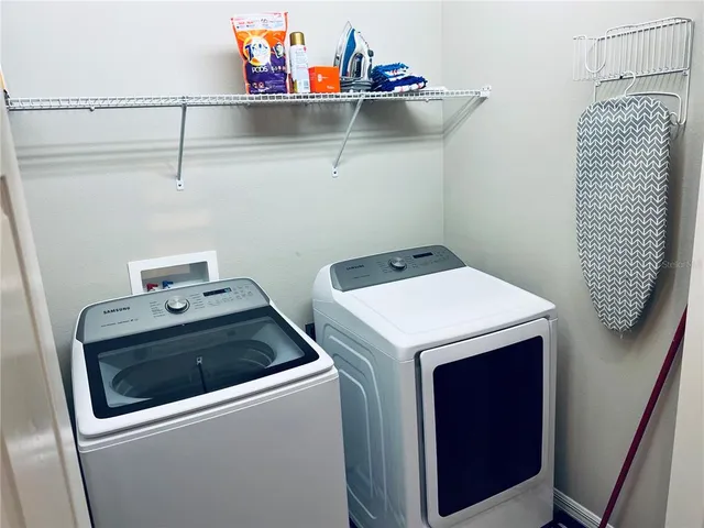 a utility room with dryer and washer