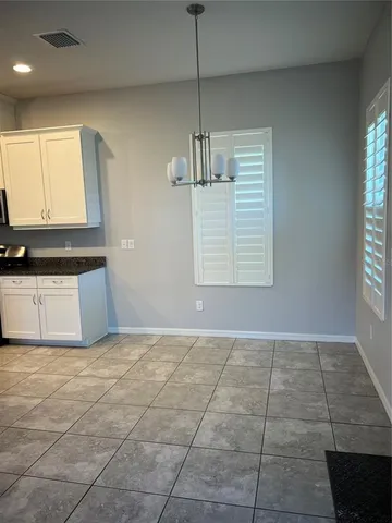 a view of a kitchen with a sink and a window