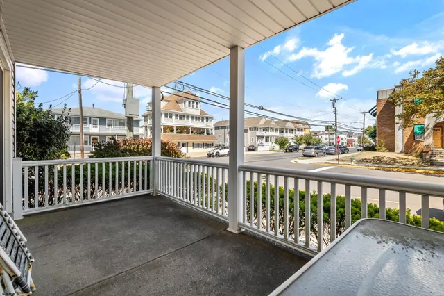 a view of a porch with a floor to ceiling window