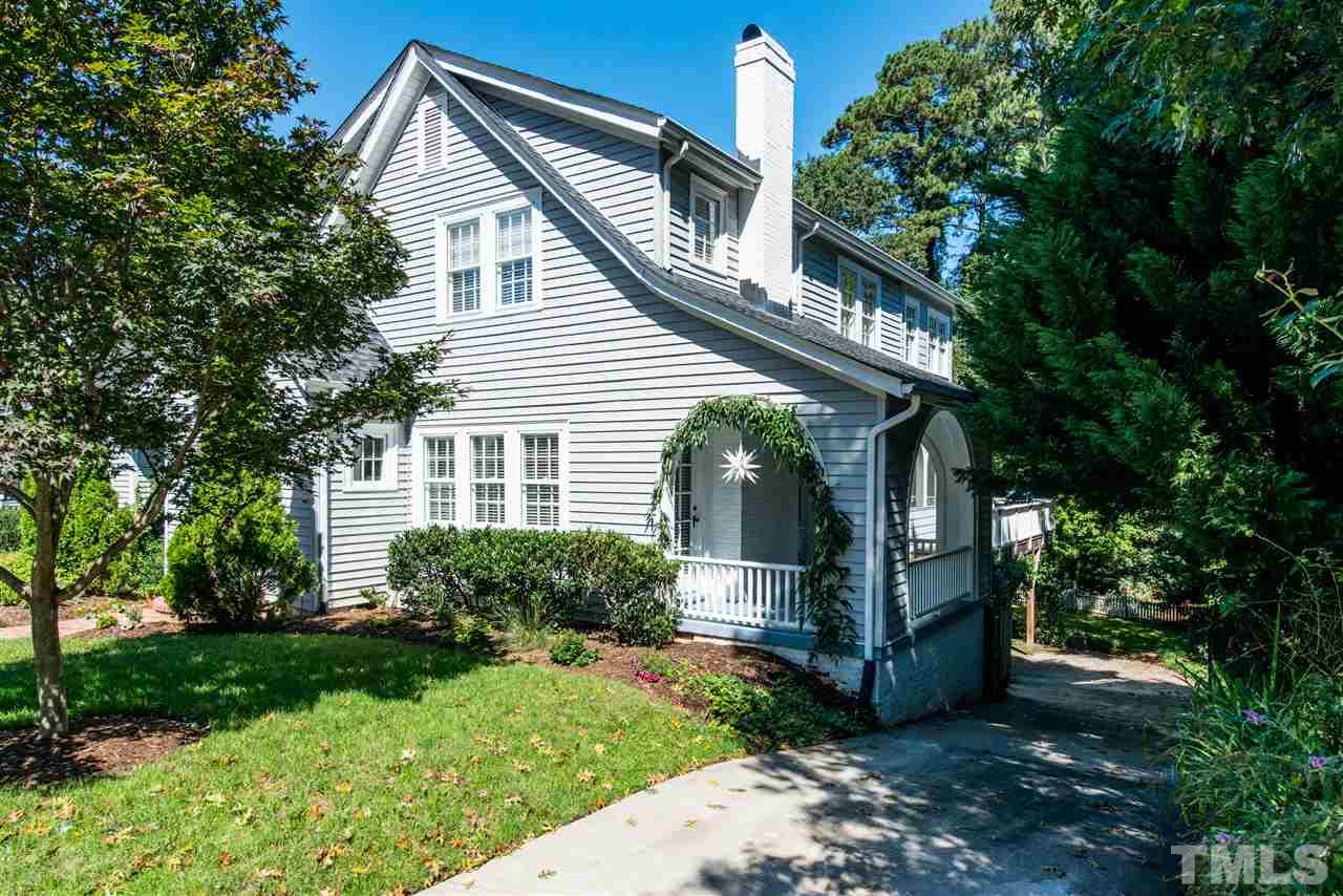 2218 Creston Road Raleigh, NC 27608 - Photo 2 of 25 a front view of a house with garden
