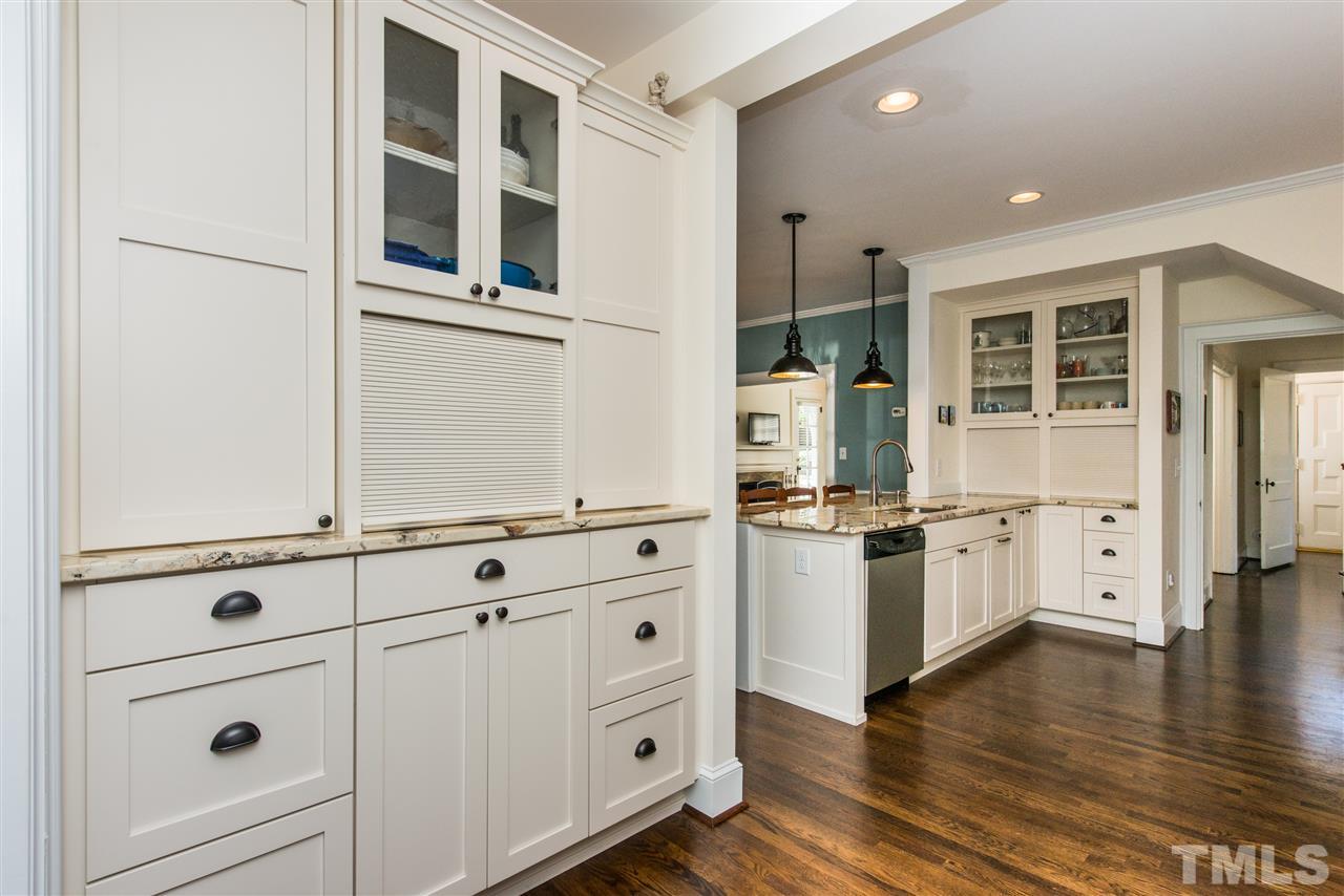 2218 Creston Road Raleigh, NC 27608 - Photo 11 of 25 a kitchen with granite countertop a stove and a refrigerator