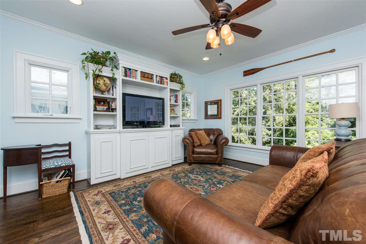 2218 Creston Road Raleigh, NC 27608 - Photo 12 of 25 a living room with furniture and a flat screen tv