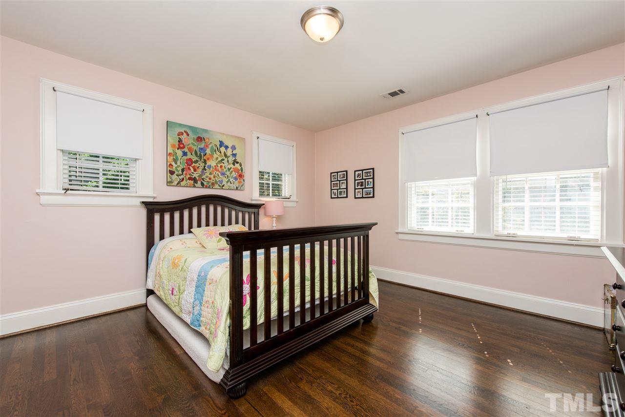 2218 Creston Road Raleigh, NC 27608 - Photo 17 of 25 a bedroom with furniture and a window