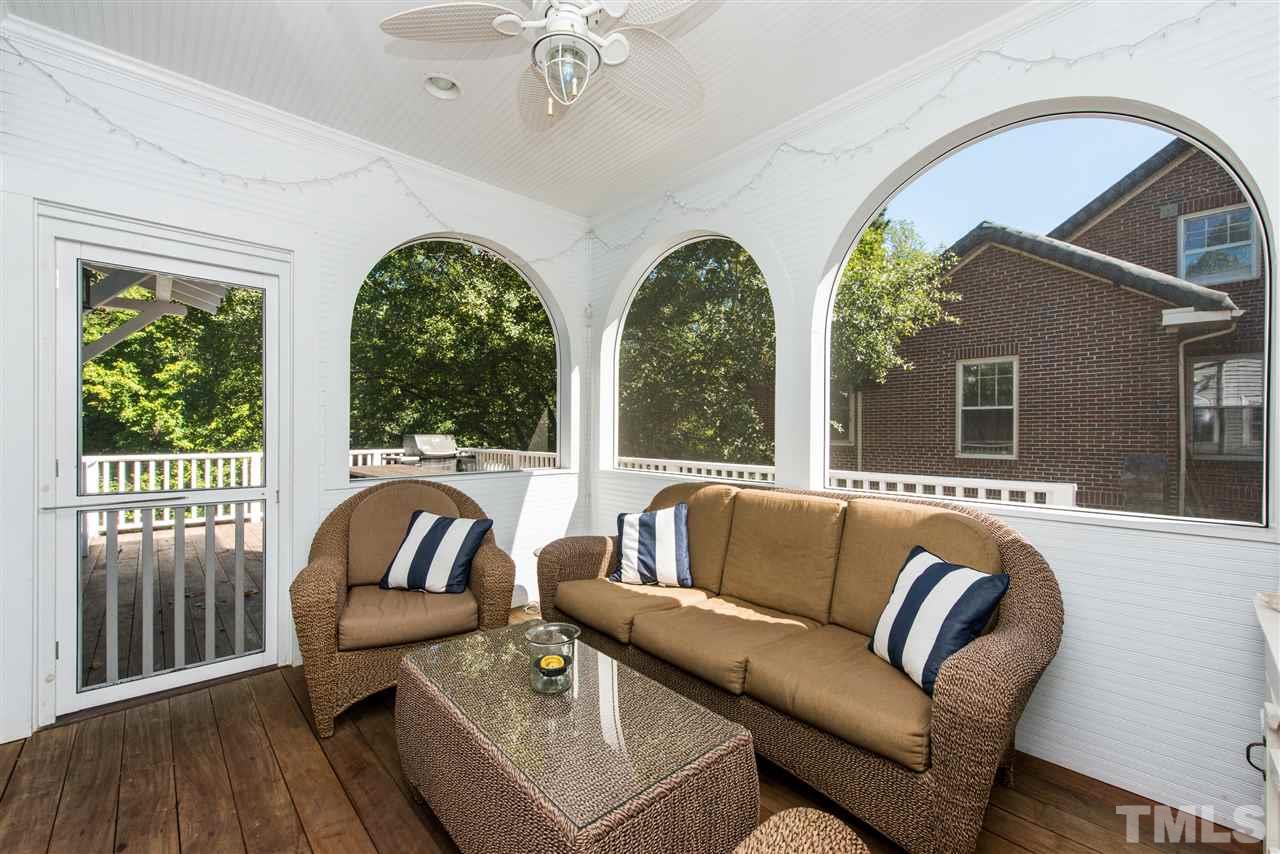 2218 Creston Road Raleigh, NC 27608 - Photo 23 of 25 a living room with furniture and a large window