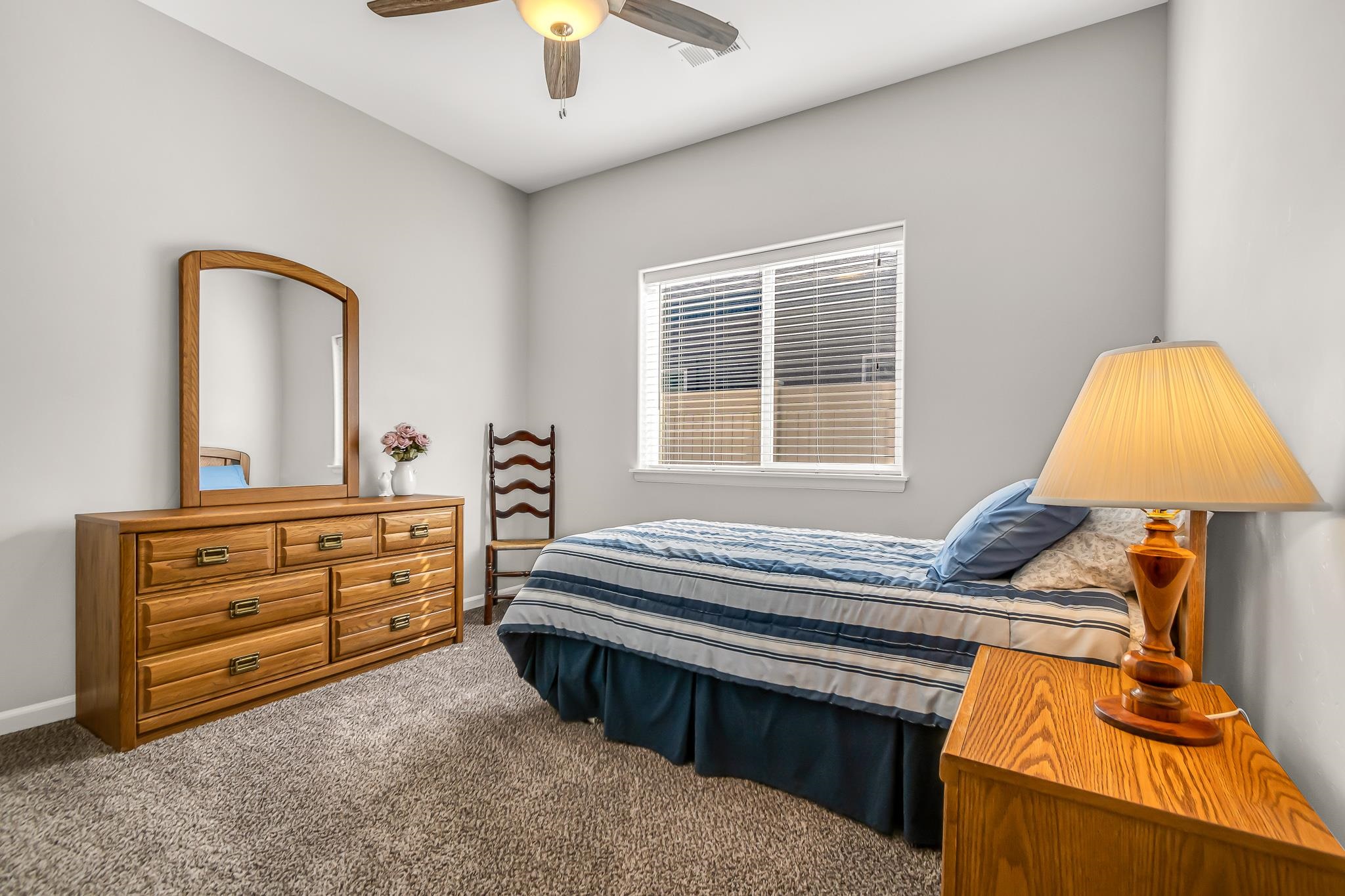 454 Lewis Street Grand Junction, CO 81504 - Photo 19 of 25 a bedroom with a bed and a dresser