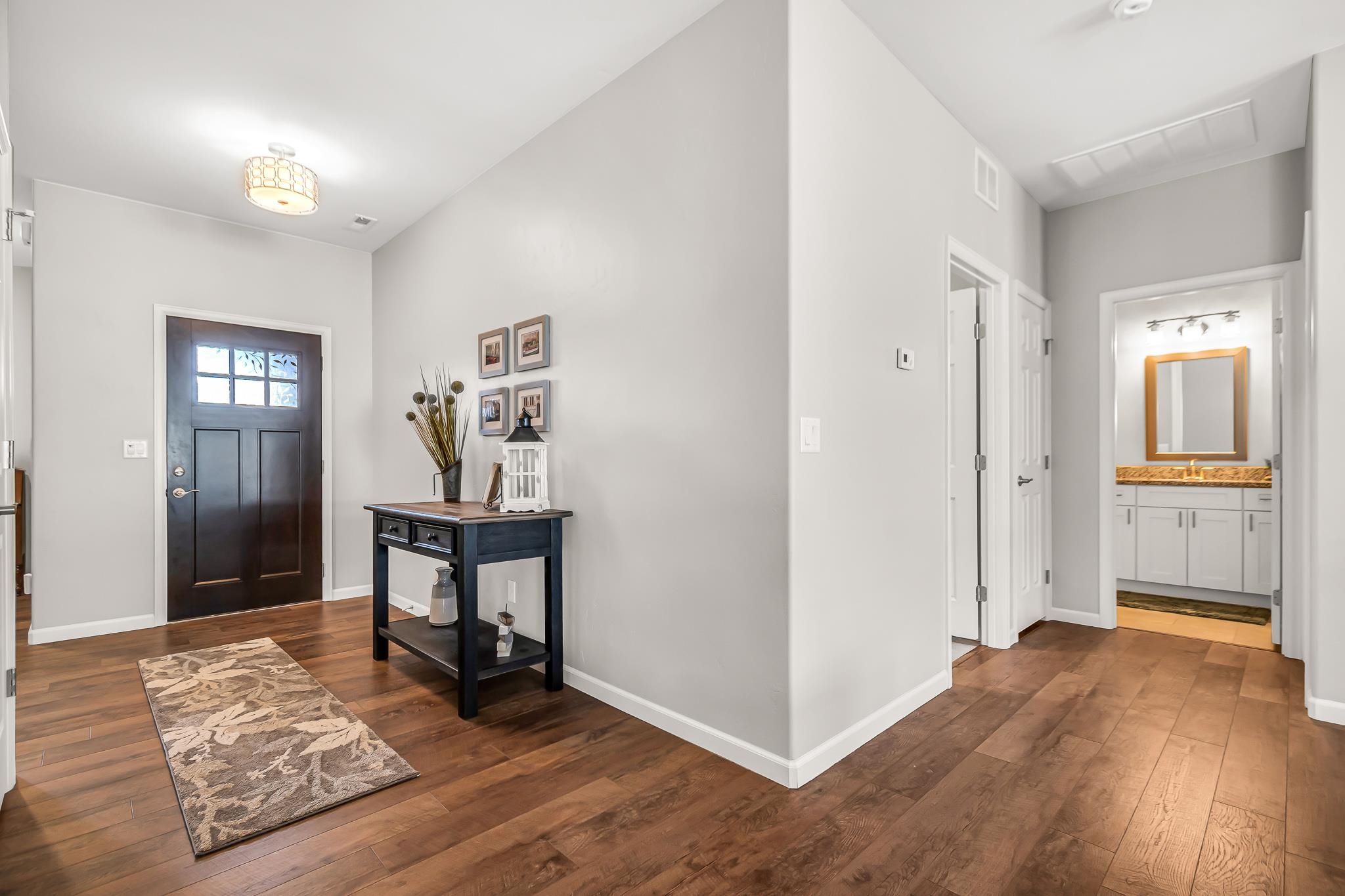 454 Lewis Street Grand Junction, CO 81504 - Photo 2 of 25 a view of an empty room and wooden floor