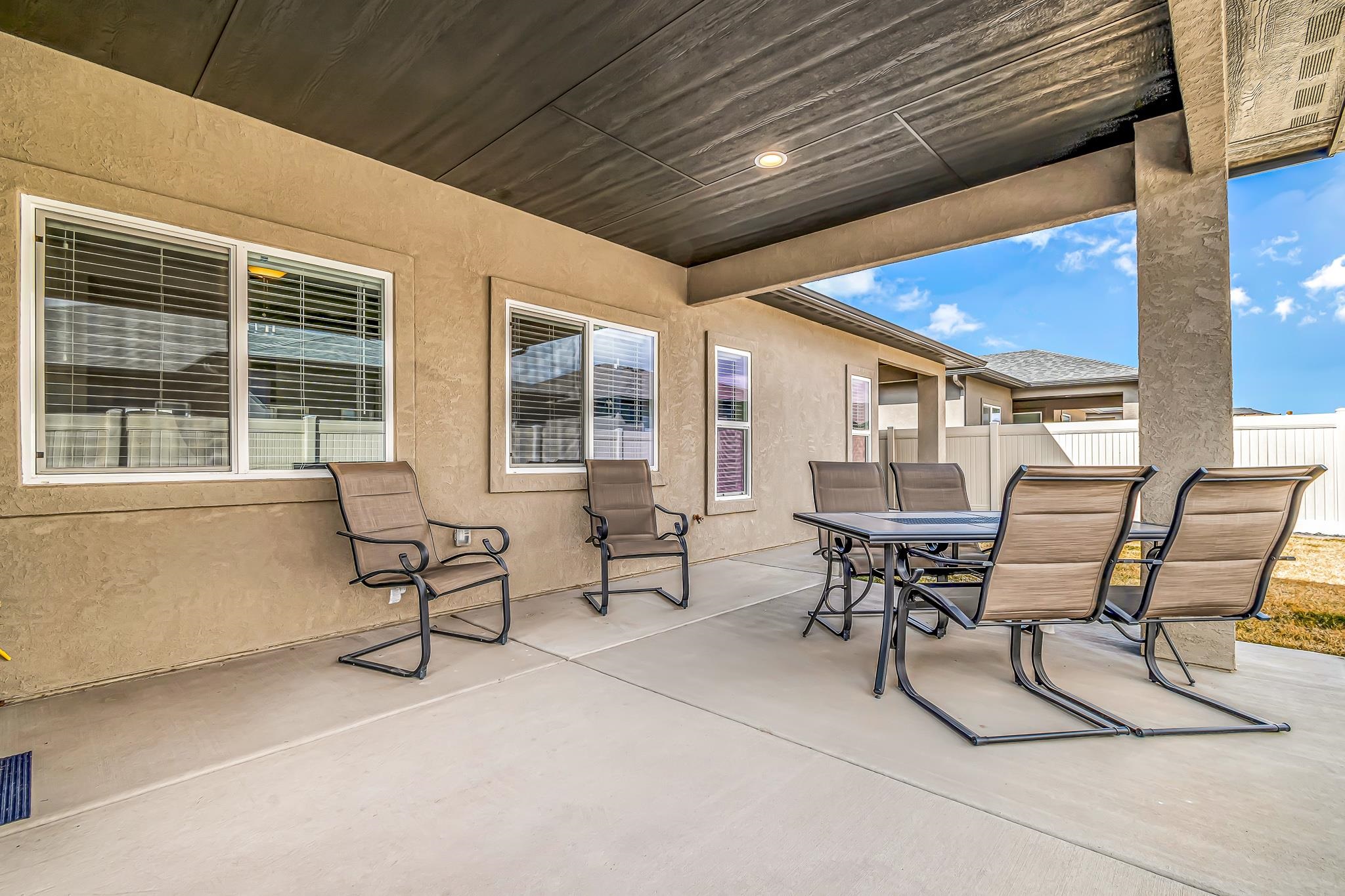 454 Lewis Street Grand Junction, CO 81504 - Photo 21 of 25 a view of a patio with table and chairs and wooden floor