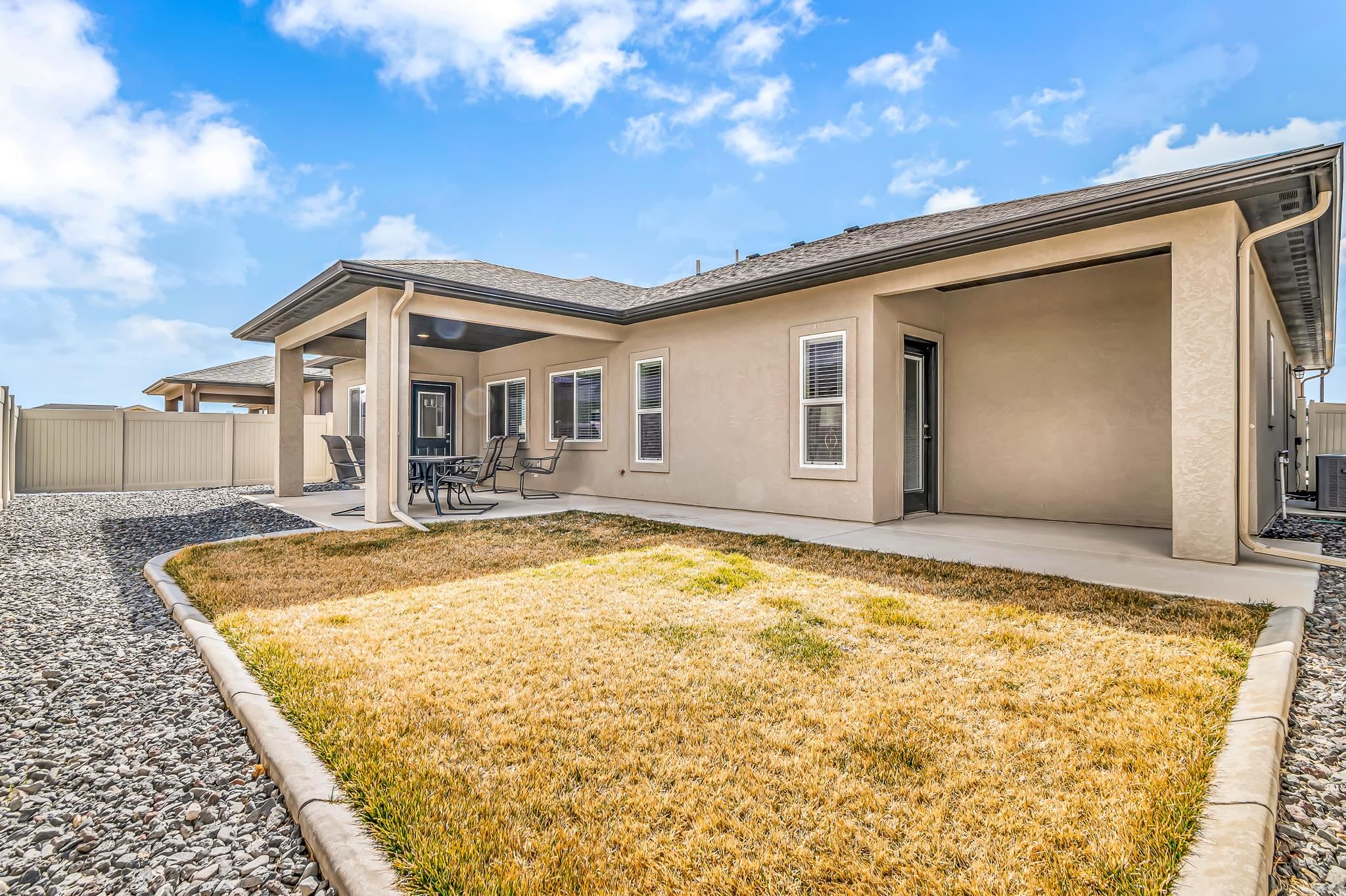 454 Lewis Street Grand Junction, CO 81504 - Photo 23 of 25 a front view of a house with a yard