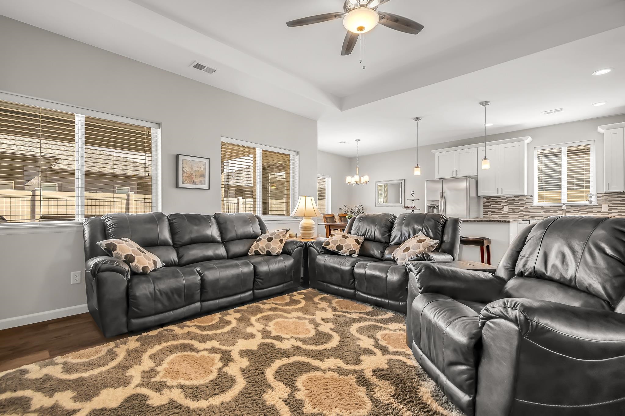 454 Lewis Street Grand Junction, CO 81504 - Photo 3 of 25 a living room with furniture and a chandelier