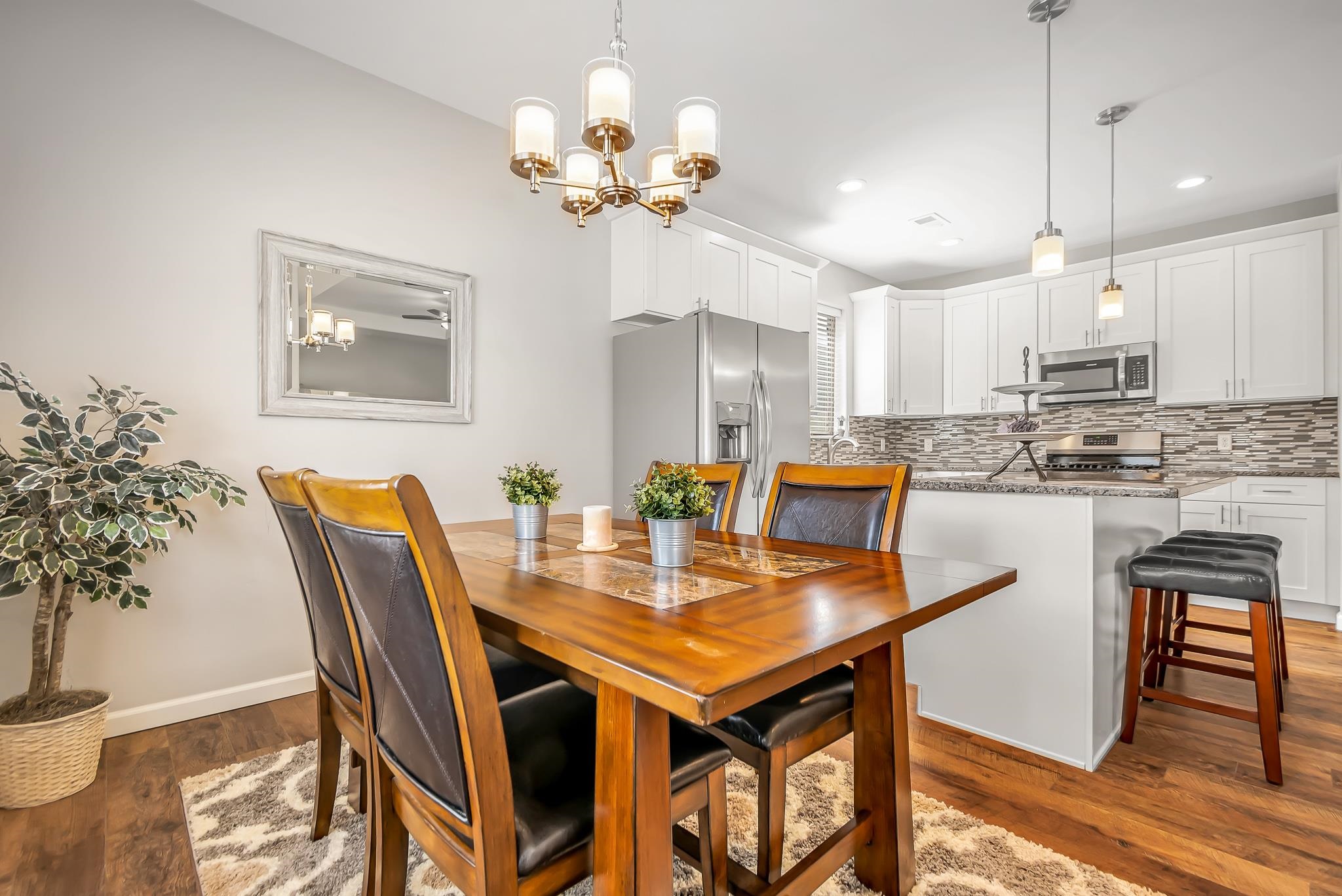 454 Lewis Street Grand Junction, CO 81504 - Photo 6 of 25 a view of a dining room with furniture and wooden floor