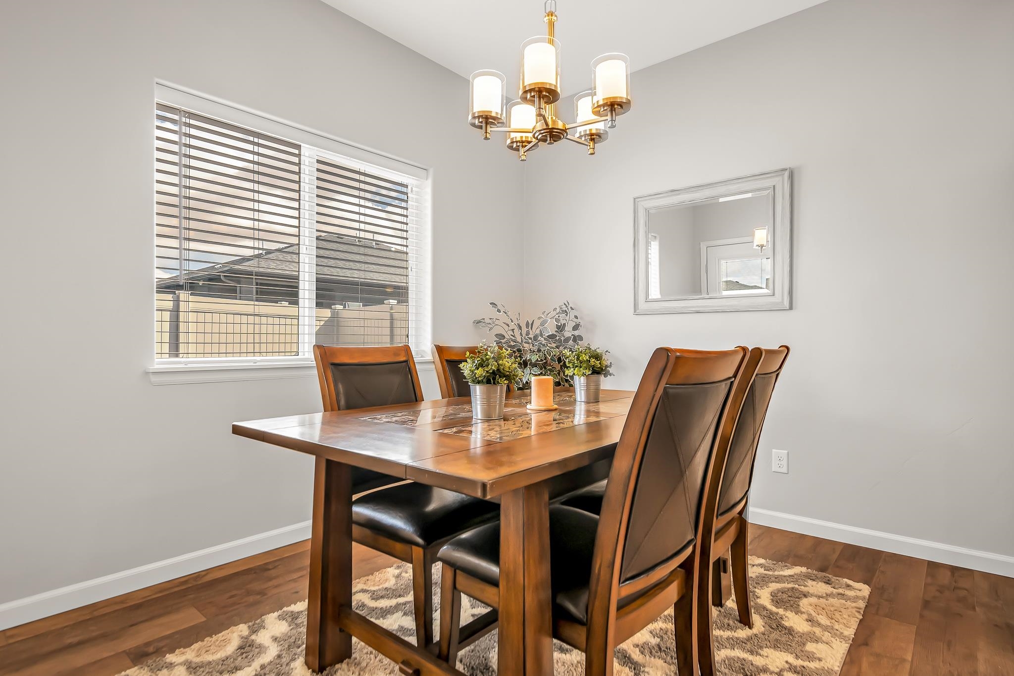 454 Lewis Street Grand Junction, CO 81504 - Photo 7 of 25 a view of a dining room with furniture window and wooden floor