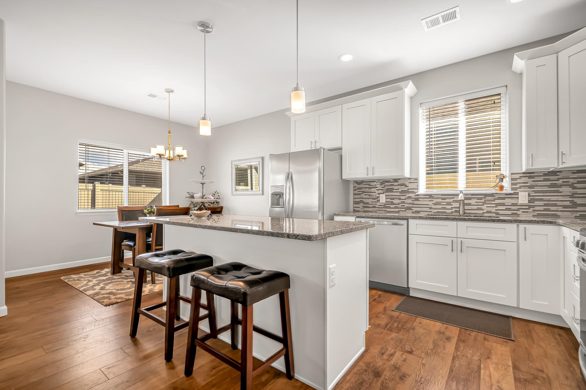 454 Lewis Street Grand Junction, CO 81504 - Photo 9 of 25 a kitchen with sink cabinets and wooden floor